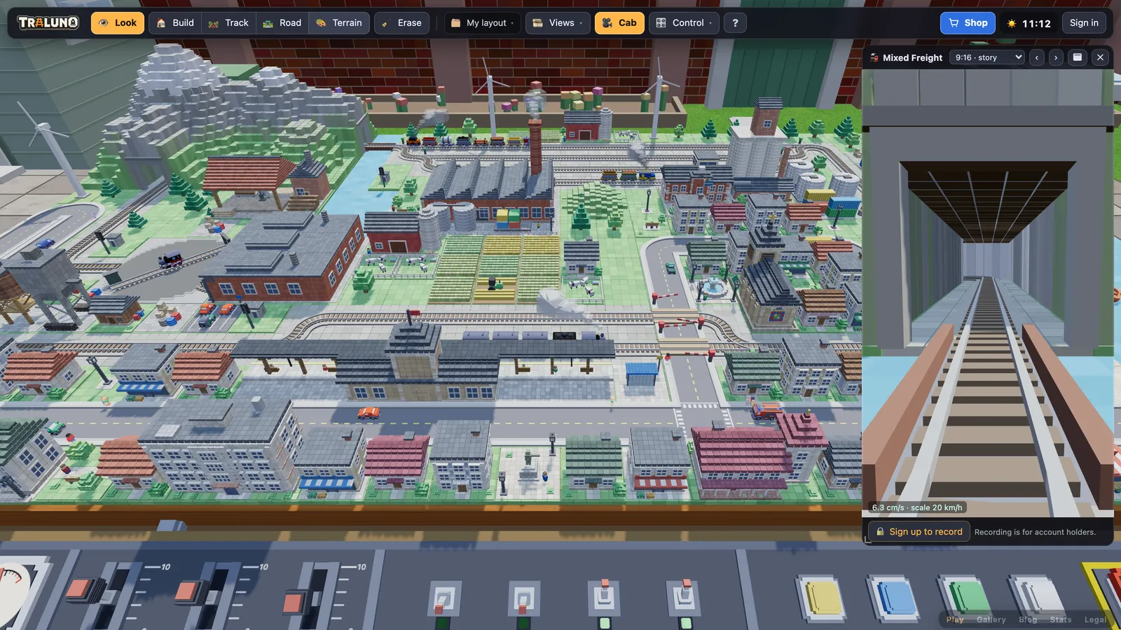 The game with the cab window open at the top right in a tall 9:16 shape, showing the Mixed Freight running towards a tunnel portal, with the framing menu in its title bar and the guest's Sign up to record prompt in its footer