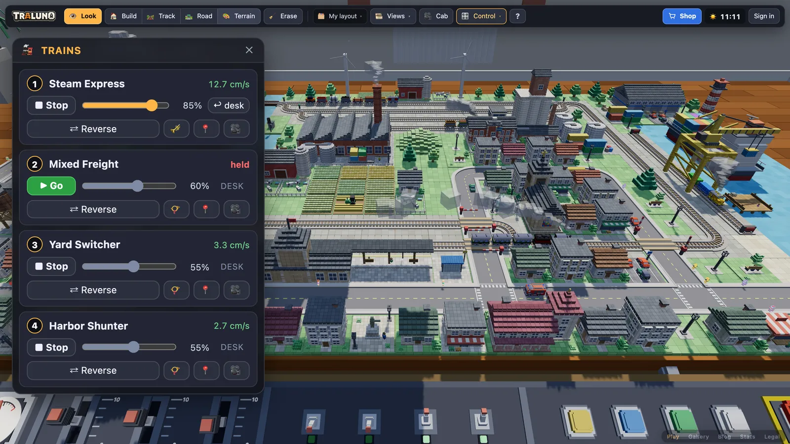 The Trains window enlarged: the Steam Express at 85 per cent with a desk button beside its slider, the Mixed Freight marked held with a green Go button, and the Yard Switcher and Harbor Shunter following the desk at 55 per cent