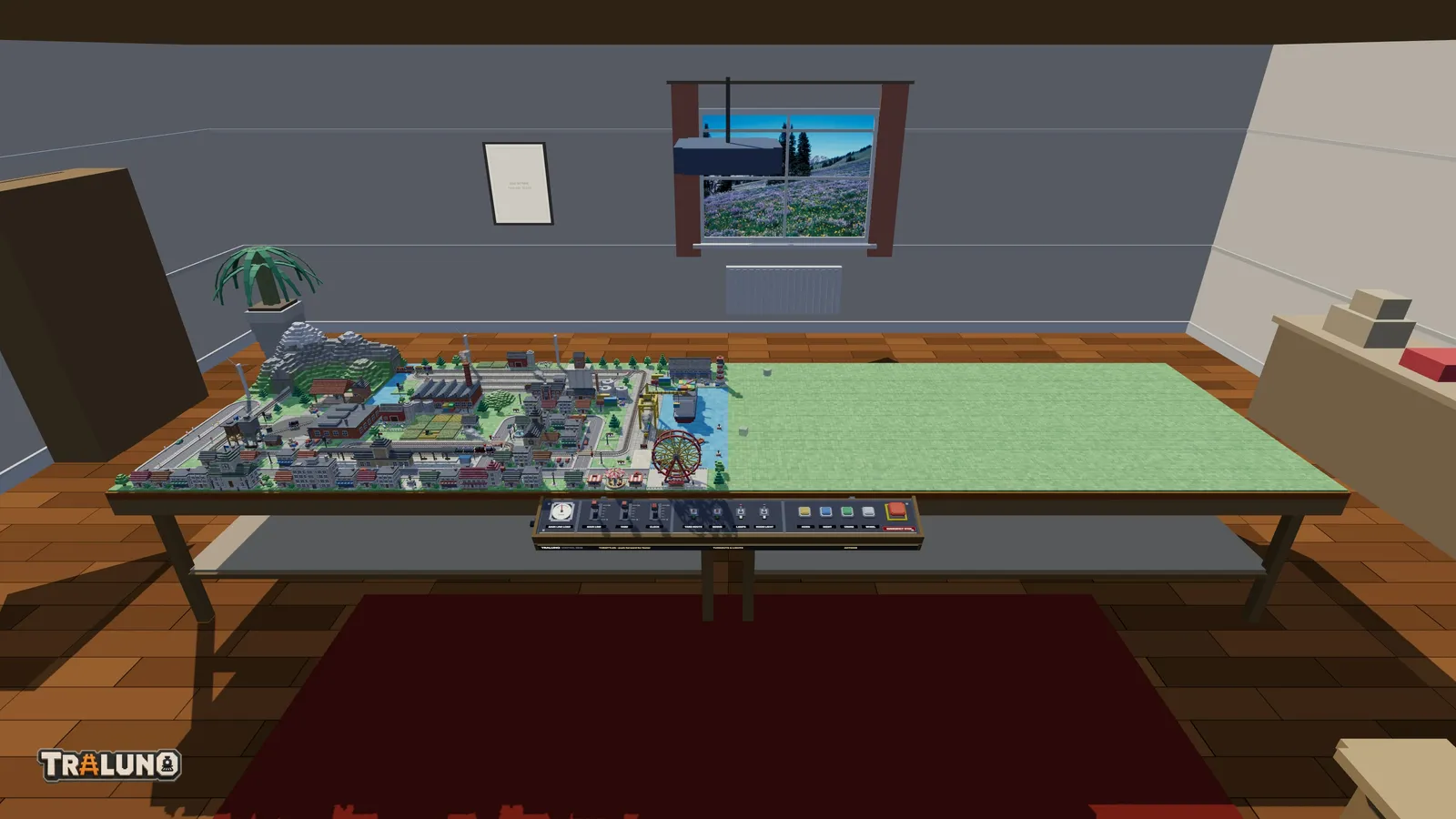 The demo layout on its table with an empty second table joined to its right-hand side, and the control desk centred on the front edge of the pair.