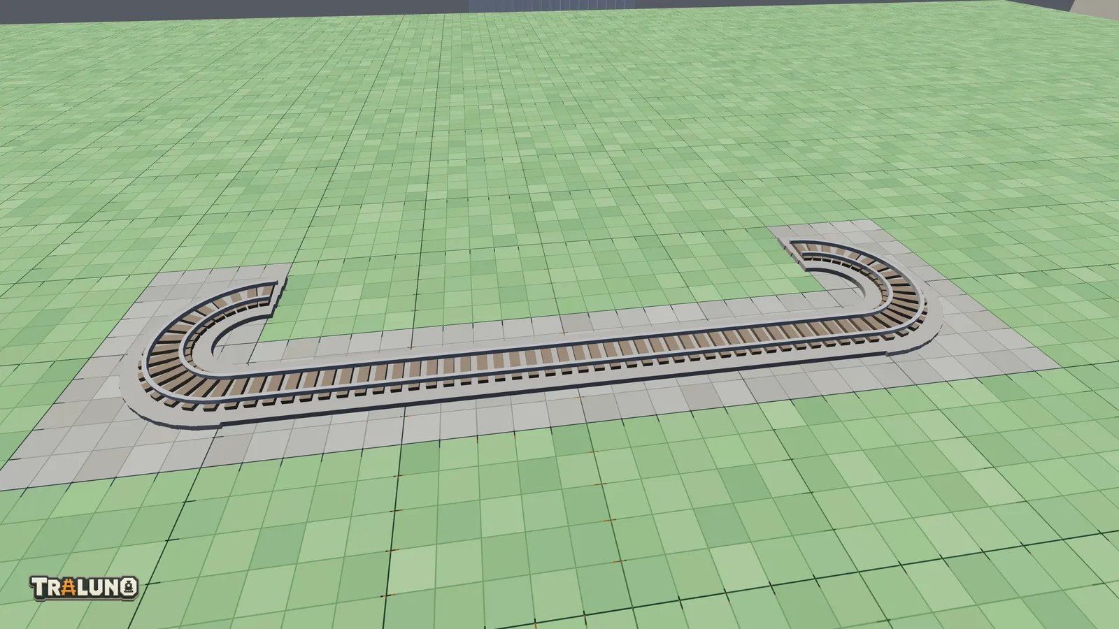 Four curved track pieces at the corners of a small oval on a bare table, with only the front run of straights laid between them.