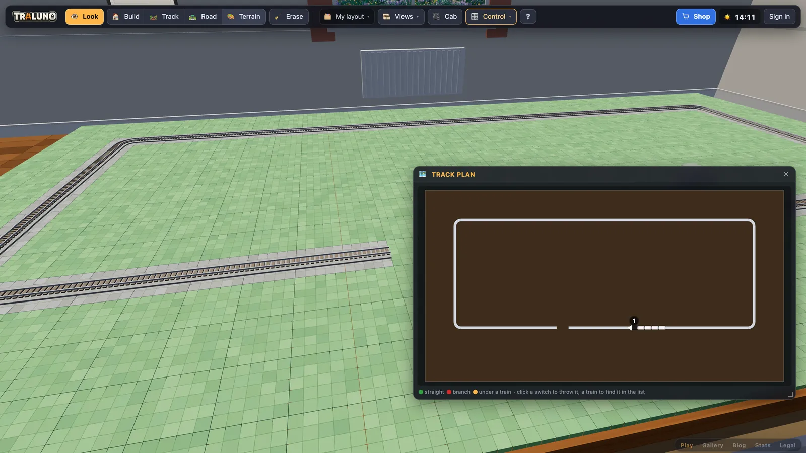 The Track plan window open over the layout, drawing the oval from above with a gap in its front straight where one piece is missing.