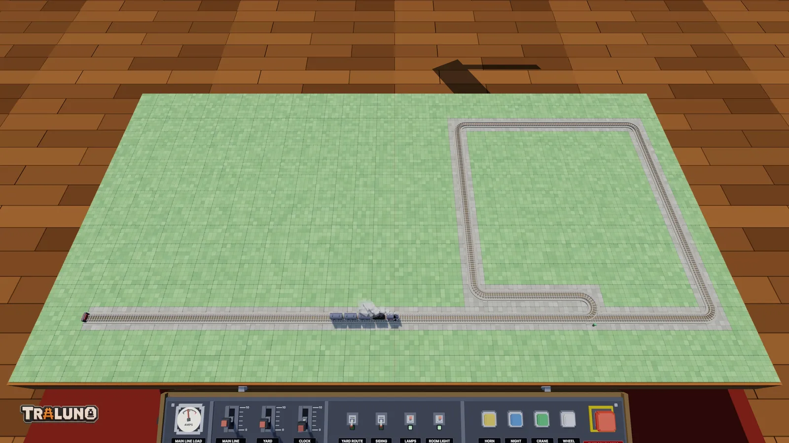 A single line along the front of the table from a buffer stop on the left to a reversing loop on the right, with the Steam Express heading out.