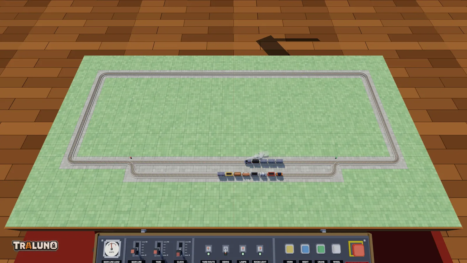 The oval with a passing loop along the front: a freight train waits in the loop while the Steam Express passes on the main line.