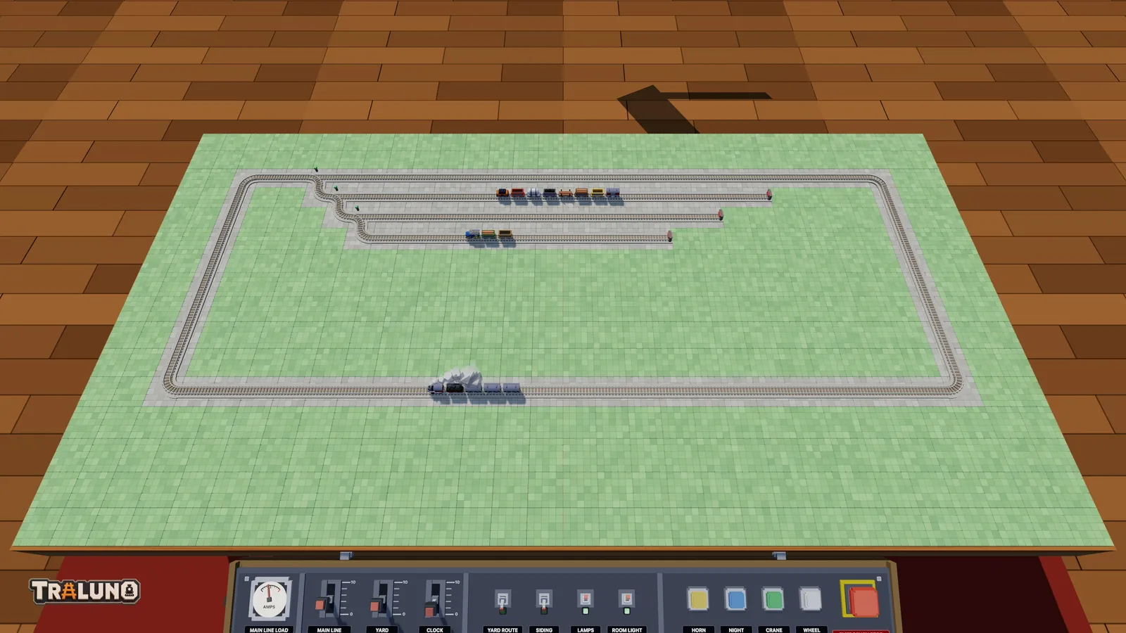 An oval with three sidings fanned off the back straight, a freight train and a shunter parked in two of them and the Steam Express on the main line.