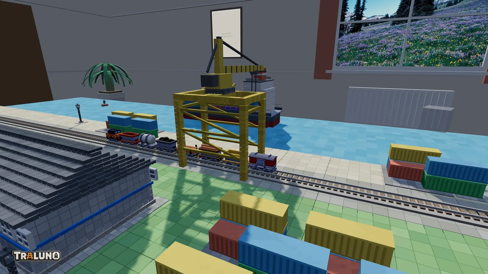 The harbour crane straddling the quay track beside the water, with a goods train standing under its portal and a cargo ship moored behind.
