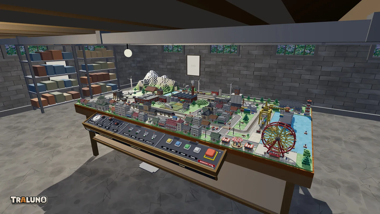 The Traluno demo layout on its wooden table in the cellar room, with the control desk along the front edge, shelves of boxes against a block wall and small windows high up.