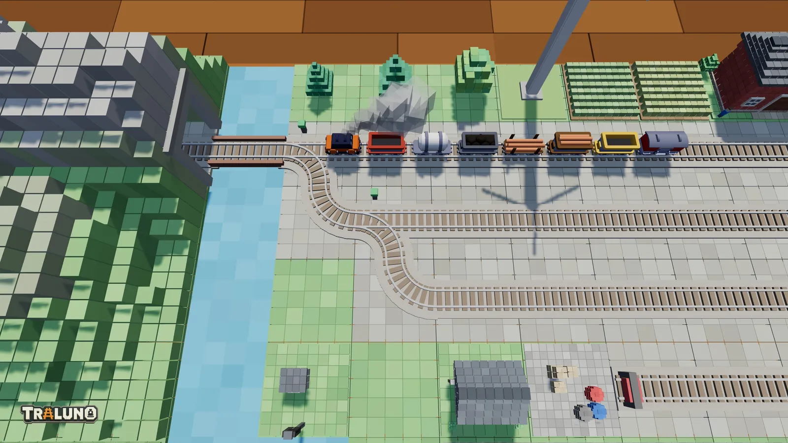 The yard throat of the demo layout from straight above, on the grid of cells: a goods train on the main line heading for a one-cell bridge and a mountain, and switches and quarter-turn curves leading off into parallel yard tracks.